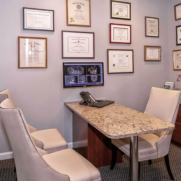 The consultation office, with the doctors' diplomas on the wall.